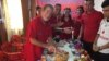 FILE - Leland Scott celebrates his birthday with his students at the Bajid Kandall 2 Yazidi refugee camp in Iraqi Kurdistan region, May 17, 2016.