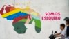 Warga melintas melewati mural bergambar wilayah Essequibo yang terpampang di salah satu sudut Caracas, Venezuela, pada 11 Desember 2023. (Foto: AP/Matias Delacroix)