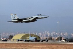 FILE - A U. S. Air Force F-15 fighter jet takes off from Incirlik Air Base, near Adana, Turkey, Dec. 15, 2015.