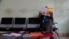 FILE - A homosexual man waits to get his antiretrovirals in a health center dedicated to the LGTBI community in Yaounde, Cameroon, Oct. 7, 2019.