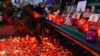 Russia -- Candles placed at a memorial for the victims of the Kemerovo mall shopping center fire. March 26, 2018