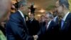 President Barack Obama (L) and his Cuban counterpart Raul Castro shake hands as U.N. Secretary General Ban Ki-moon (R) looks on, before the inauguration of the VII Summit of the Americas in Panama City, April 10, 2015.