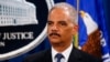 Attorney General Eric Holder listens during a news conference on charges filed against five Chinese military officials for cyber theft of business secrets, at the Justice Department in Washington, May 19, 2014.