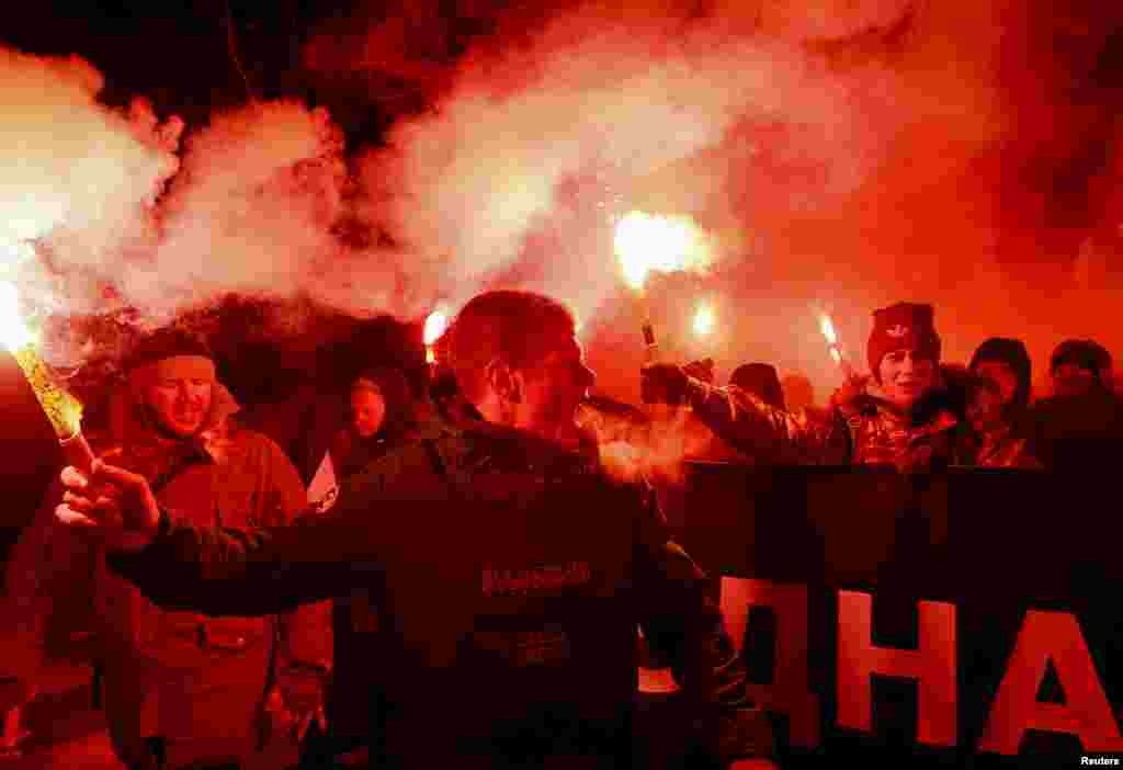 Activists of the Ukrainian nationalist parties take part in a rally during celebrations for Unity Day in Kyiv. Ukraine has been celebrating the anniversary since the western and eastern parts of the country were unified to create a single state in 1919.