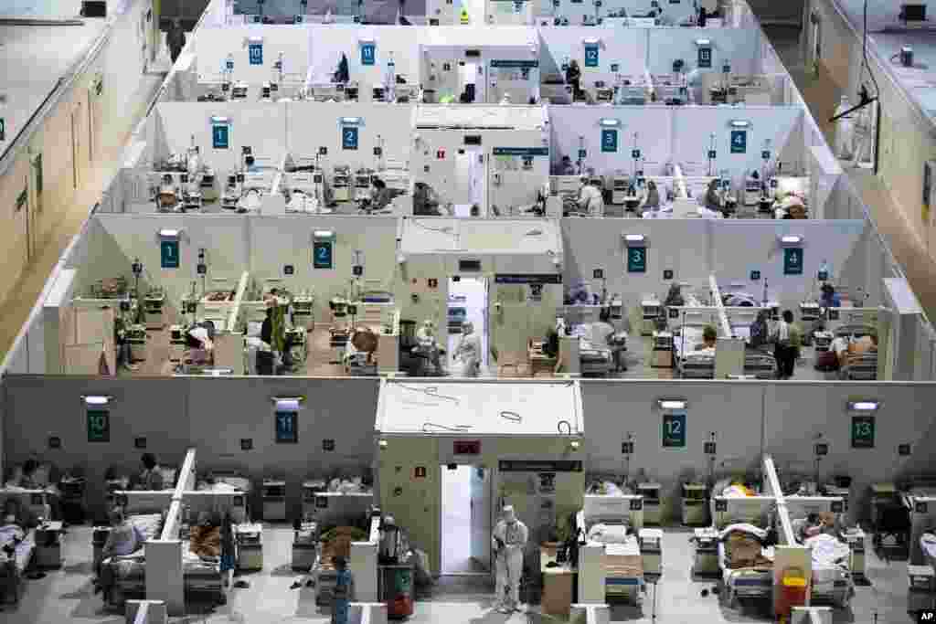 Medical workers and patients are seen in the treatment hall of a temporary hospital for coronavirus patients in the Krylatskoye Ice Palace in Moscow, Russia.&nbsp;