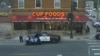 In this May 25, 2020, image from surveillance video, Minneapolis police officers, from left, Tou Thao, Derek Chauvin, J. Alexander Kueng and Thomas Lane are seen attempting to take George Floyd into custody in Minneapolis, Minnesota.
