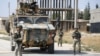 FILE - Turkish soldiers patrol the northern Syrian Kurdish town of Tal Abyad, on the border between Syria and Turkey, Oct. 23, 2019.