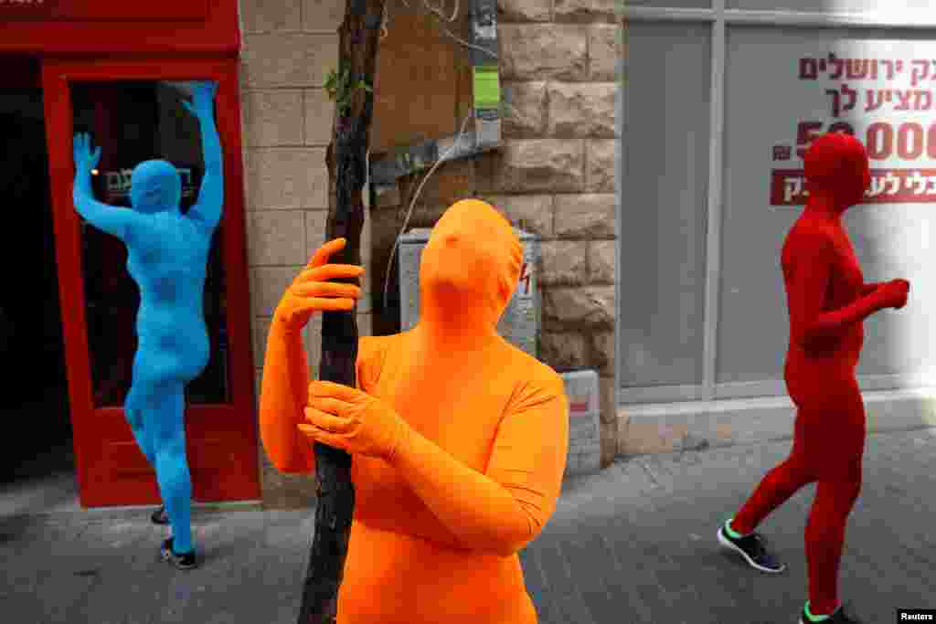 Members of the Prizma Ensemble wearing full solid-colored bodysuits take part in the 6th Jane&#39;s walk Jerusalem in Jerusalem, Israel.