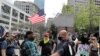 FILE - Members of a far-right group argue with a Black counterprotester during a rally in downtown Seattle, Washington, May 1, 2020.