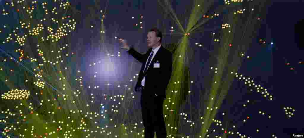 Employee Lothar Baum explains how a 'Data Mining' 12-million-pixel-wide screen works before the official opening ceremony of the BOSCH company's new center for research and advance engineering Campus Renningen in Renningen, Germany. 