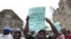 Teachers demonstrate outside Kenya's Parliament Buildings in the capital Nairobi September 7, 2011. Many Kenyan state schools remained closed on Tuesday after thousands of teachers went on strike to try to force the government to increase their numbers.