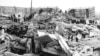 Teams of workers climb over rubble left by the earthquake. Leninakan, Armenia, Dec. 12, 1988. 