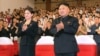 North Korean leader Kim Jong-Un (R) applauds with his wife Ri Sol-Ju (L) during a demonstration performance by the newly formed Moranbong band in Pyongyang in this undated picture released by the KCNA July 9, 2012