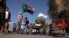 Sudan protesters - burnt tires tyres burned - smoke - fire - barricade Khartoum