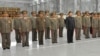 North Korea defense commission vice chairman Jang Song Taek is seen in a dark brown uniform third from left in the first row at a ceremony in Pyongyang, September 9, 2012. (Rodong Sinmun photo) 