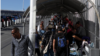 Migrants and regular border crossers are seen at the El Paso del Norte Bridge between Mexico and the U.S. The international bridge separates two border towns: El Paso in Texas from Ciudad Juarez in Mexico. (R. Taylor/VOA)