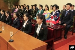 Colleagues and family members of 12 North Korean waitresses are presented to local and foreign media in Pyongyang, North Korea, May 3, 2016.