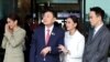 FILE - Former Thai Prime Minister Thaksin Shinawatra walks with his son Panthongtae Shinawatra and daughters Paetongtarn Shinawatra and Pintongtha Kunakornwong at Don Mueang airport in Bangkok, Thailand August 22, 2023. 