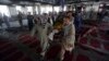 Men carry the coffin of a victim of a suicide attack at a Shiite mosque, Aug. 26, 2017, in Kabul, Afghanistan.