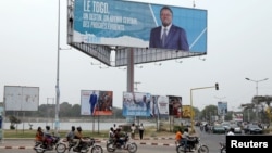  FILE - A billboard of Faure Gnassingbe is pictured on a street in Lome, Togo, Feb. 19, 2020.