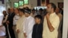 FILE - American Muslims offer Eid al-Fitr prayers in a community center in northern Virginia, Aug. 8, 2013. Muslims are relatively few in number in the U.S. but tend to live in swing states that can have an impact on election outcomes. (M. Elshinnawi/VOA)
