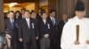 Japanese lawmakers, including cabinet ministers, are led by a Shinto priest as they visit the Yasukuni Shrine for the war dead in Tokyo, October 18, 2012.