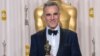 After winning the Oscar® for performance by an actor in a leading role for his role in “Lincoln”, actor Daniel Day-Lewis poses backstage for the press with his Oscar®. (Photo: Heather Ikei / AMPAS)