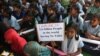 Indian school children participate in a rally to mark World Toilet Day in Hyderabad, India, Nov.19, 2014.