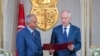Tunisian President Kais Saied (L) meets with Prime Minister-designate Habib Jemli in Tunis, Tunisia, in this handout picture obtained by Reuters from the Tunisian Presidency, Nov. 15, 2019.