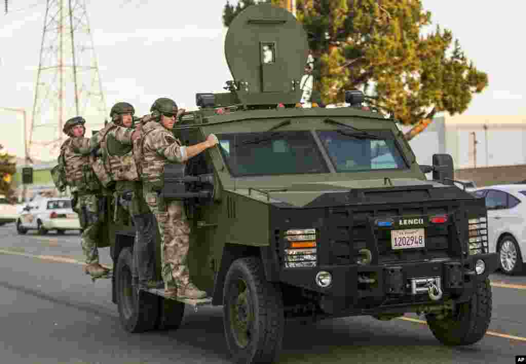Authorities search an area near where police stopped a suspected vehicle in San Bernardino, California, Dec. 2, 2015, following a shooting that killed 14 people at a social services center for the disabled.