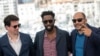 Producer Christophe Barral, from left, director Ladj Ly and producer Toufik Ayadi pose for photographers at the photo call for the film 'Les Miserables' at the 72nd international film festival, Cannes, southern France, May 16, 2019. 