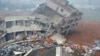 Rescuers look for survivors after a landslide hit an industrial park in Shenzhen, south China's Guangdong province on Dec. 20, 2015.