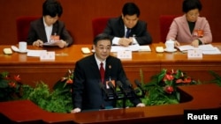 Zhou Qiang, President of China's Supreme People's Court, gives a speech during the third plenary session of the National People's Congress (NPC) at the Great Hall of the People, in Beijing, March 12, 2017. 