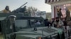 Taliban fighters stand guard in Kunduz city, northern Afghanistan, Aug. 9, 2021. The militants have ramped up their push across much of Afghanistan in recent weeks, turning their guns on provincial capitals.