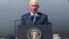 FILE - U.S. Vice President Mike Pence delivers a speech during a meeting with U.S. troops taking part in NATO led joint military exercises Noble Partner 2017 at the Vaziani military base near Tbilisi, Georgia, Aug. 1, 2017.