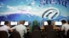 Iranians surf the internet at a cafe in Tehran, Iran, Sept, 17, 2013. In Iran, a government push for a 'halal' internet means more control after protests.