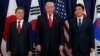 FILE - President Donald Trump poses for a picture with Japanese Prime Minister Shinzo Abe, right, and South Korean President Moon Jae-in ahead of a security meeting in Hamburg, Germany, July 6, 2017.