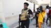 FILE - Gang leader Jimmy "Barbecue" Cherizier talks to reporters in Port-au-Prince, Haiti, March 11, 2024. Armed men working under Cherizier ambushed a police patrol vehicle in the Delmas 18 neighborhood June 9, 2024, and set it on fire, police said. Three officers died.
