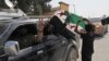 Members of Turkey-backed Syrian National Army (former FSA) flash the V-sign as they drive back to Turkey near the border between Turkey and Syria, in Akcakale, Sanliurfa province, southeastern Turkey, Oct. 9, 2019.