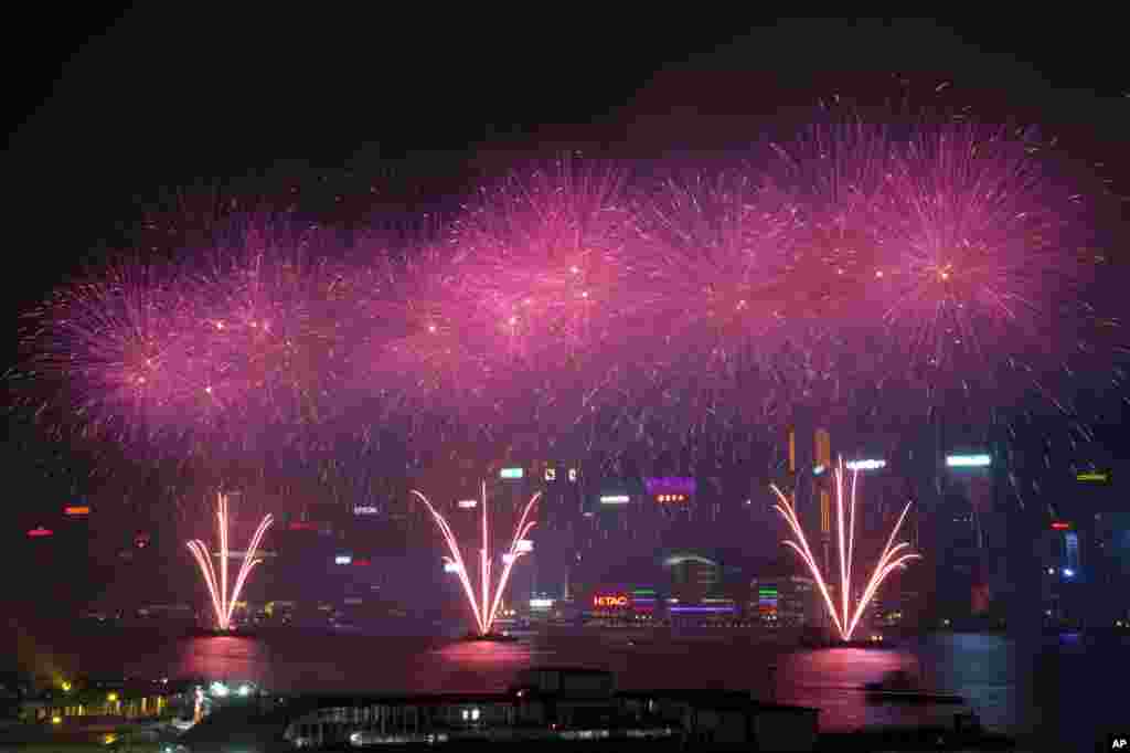 Fireworks explode over Hong Kong's Victoria Harbor to celebrate the 66th anniversary of China's National Day in Hong Kong.