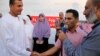 Alia's uncle (L) stands for his niece as Mohammad takes marriage vows which include that ousted President Mohamed Morsi is still the president, in Cairo, Aug. 6, 2013. (Photo: H. Elrasam for VOA.) 