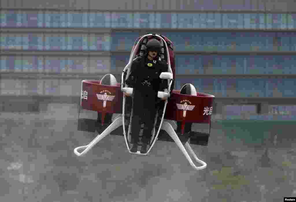 Michael Read, director of Flight Operations from New Zealand-based Martin Aircraft Company, flies a Martin Jetpack during a demonstration at a water park in Shenzhen, China. KuangChi Science Ltd, a Hong Kong-listed Chinese company and investor of Martin Aircraft, will sell the flying machine in mainland China for 1.6 million yuan ($249,902), according to the company.