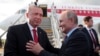Russia's President Vladimir Putin, right shakes hands with Turkey's President Recep Tayyip Erdogan, prior to his departure from Zhukovsky, outside Moscow, Aug. 27, 2019. 