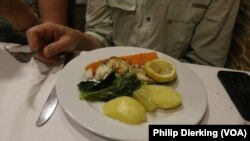 A Portuguese meal of cod fish and potatoes. Cod is one of the most commonly eaten fish in Portugal.
