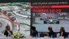 President and CEO of Formula 1 Chase Carey, left, Hanoi Mayor Nguyen Duc Chung, second from left and two other officials watch the Hanoi F1 circuit design on the screen in Hanoi, Vietnam, Wednesday, Nov. 7, 2018.