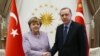 FILE - Turkey's President Recep Tayyip Erdogan meets with German Chancellor Angela Merkel at the Presidential Palace in Ankara, Feb. 2, 2017. The two will next meet Jan. 24, 2020, in Istanbul.