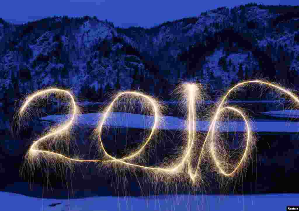 The year "2016" is written in the air with a sparkler on the banks of the Yenisei River in the Taiga district, near the town of Divnogorsk outside Siberian city of Krasnoyarsk, Russia.