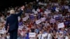 Republican presidential candidate Donald Trump waves to the crowd as he arrives at a campaign rally at the University of North Carolina Wilmington, in Wilmington, N.C., Aug. 9, 2016. 