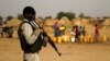 FILE - A Nigerien soldier stands guard in a camp in the city of Diffa following attacks by Boko Haram fighters in Niger's Diffa region, June 18, 2016.