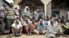 FILE - Somalians come out onto the streets after the government and AU troops drove al-Shabab militants from their community as part of their military offensive dubbed Indian Ocean aiming to oust al-Shabab from its last major hideouts.